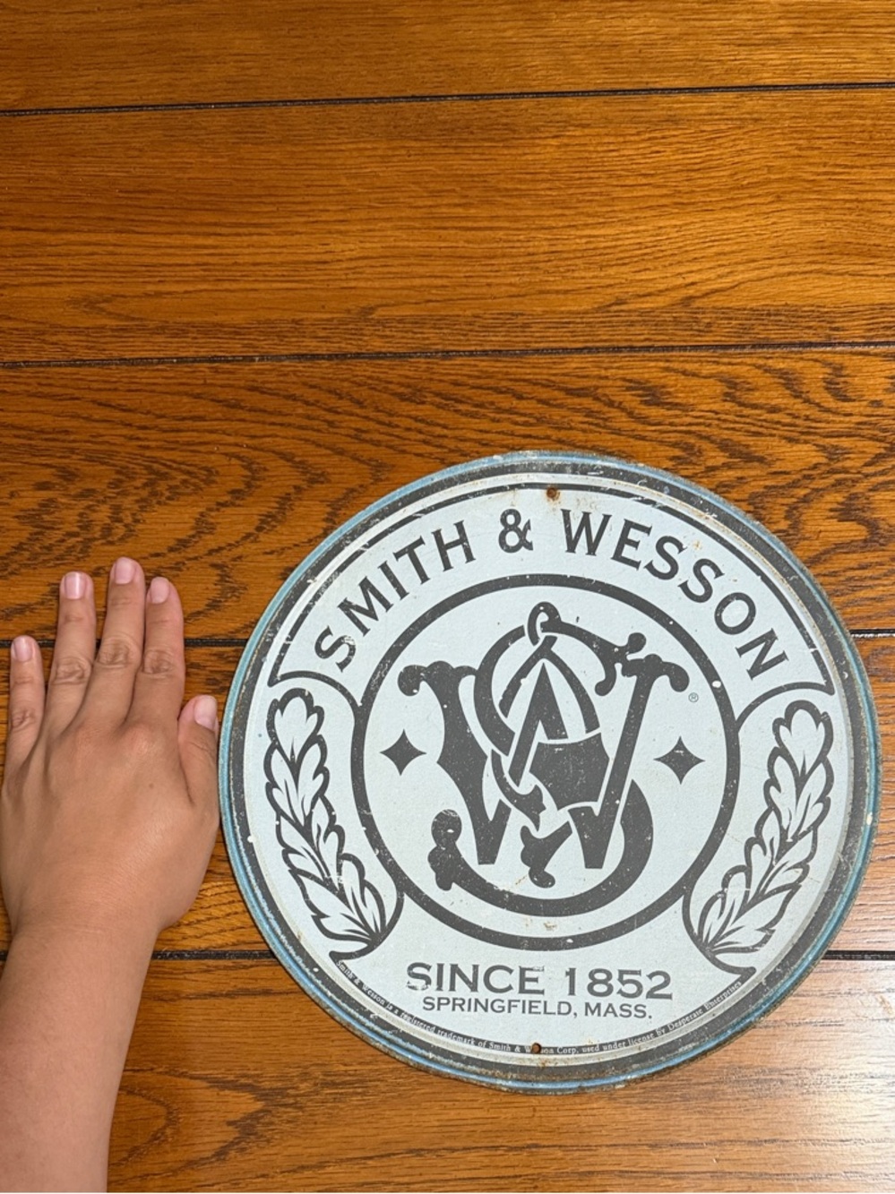 Collectable vintage Smith & Wesson Round Metal Wall Plaque